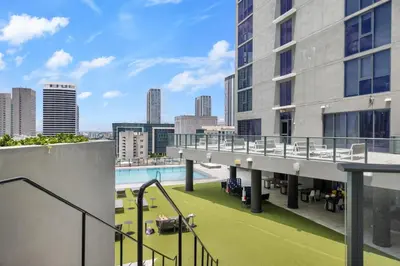 a view from the balcony of a building with a pool at Downtown Miami Luxe Studio Suite in Miami