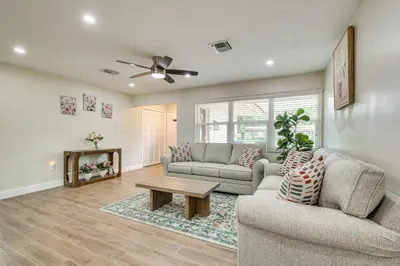 a living room with two couches and a table at Backyard Oasis Fort Lauderdale Home Near Beach in Fort Lauderdale
