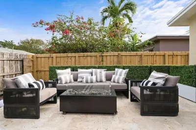 a patio with couches and a coffee table at NEW Hollywood Luxury Villa, Game Room, Hot Tub 12, Fire Pit & BBQ in Hollywood