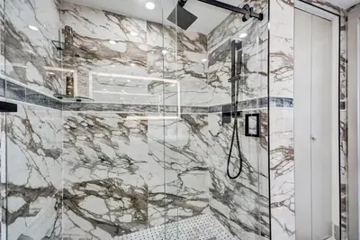 a bathroom with a shower with a glass door at Luxury Beachside 3BR 3BA Condo Resort Amenities Pools Gym and Sauna 620 in Miami Beach