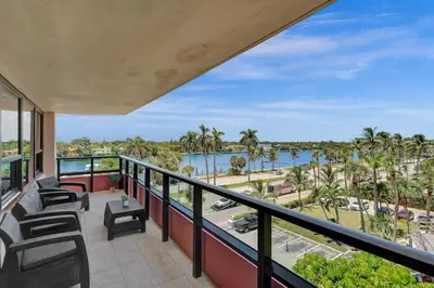 a balcony with chairs and a view of the water at Luxury Beachside 3BR 3BA Condo Resort Amenities Pools Gym and Sauna 620 in Miami Beach
