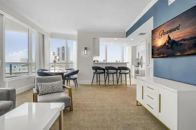 a living room with a kitchen and a dining room at FontaineBleau Suite Ocean View in Miami Beach