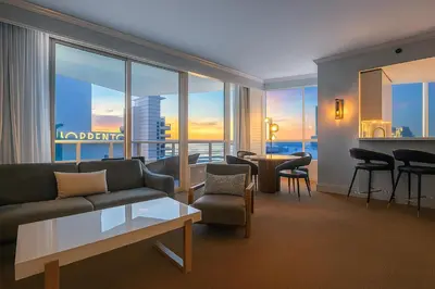 a living room with a couch and a table at FontaineBleau Suite Ocean View in Miami Beach