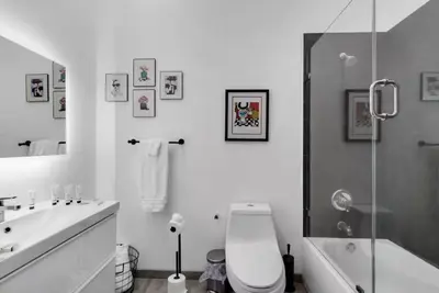 a bathroom with a toilet and a sink and a shower at Cozy Studio in Brickell free parking in Miami