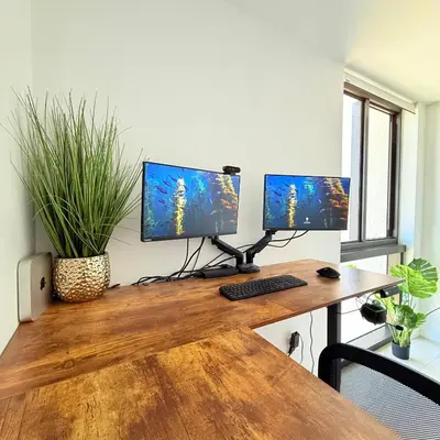 a desk with three monitors on top of it at Luxury Pent House Suite with Downtown Views in Miami