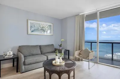 a living room with a couch and a table at W hotel High end ocean view 2 bedroom at icon brickell in Miami