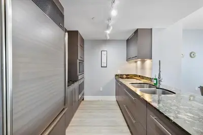 a kitchen with stainless steel cabinets and a sink at W hotel High end ocean view 2 bedroom at icon brickell in Miami