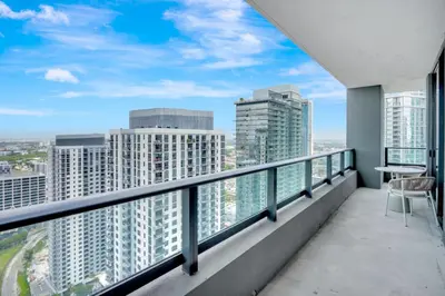 a balcony with a view of the city at 40th floor lux condo with pool, gym and spa access in Miami