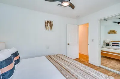 a bedroom with a bed and a mirror at Fox Garden Luxury Boho Near Downtown & Beach in Fort Lauderdale