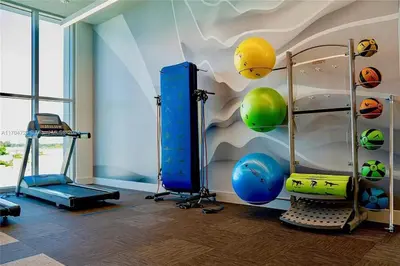 a room with a gym with balls on the wall at Luxury Penthouse Water Views Massive Terrace in Miami