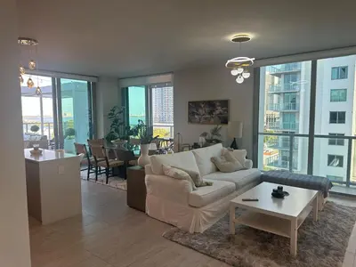 a living room with a couch and a table at Luxury Penthouse Water Views Massive Terrace in Miami
