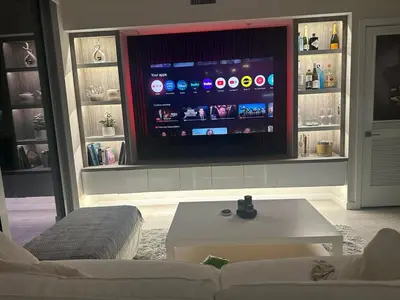 a living room with a tv and a white couch at Luxury Penthouse Water Views Massive Terrace in Miami