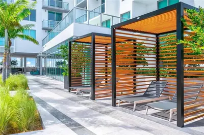 a gazebo with two chairs in front of a building at Luxury Penthouse Water Views Massive Terrace in Miami