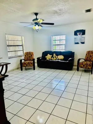 a living room with a couch and two chairs at Love Story Pool House, free parking & BBQ in Miami