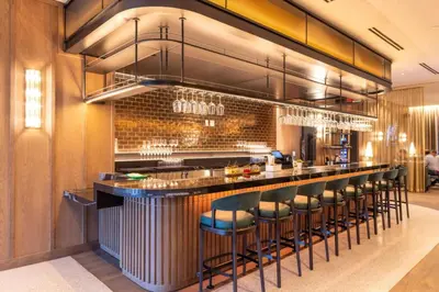 a bar in a restaurant with bar stools at 2916 Heart of Downtown Apt with Gym a Pool and a Coworking Space in Miami