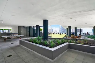 a building with columns and plants on the roof at Ocean Front Condo Near Cruise Port, Bayfront Park, plus Free Parking in Miami