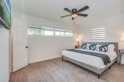 a bedroom with a bed and a ceiling fan at Fox Private Resort- Near Downtown & Beach in Fort Lauderdale