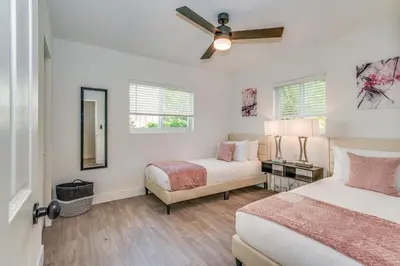 a bedroom with two beds and a ceiling fan at Fox Private Resort- Near Downtown & Beach in Fort Lauderdale