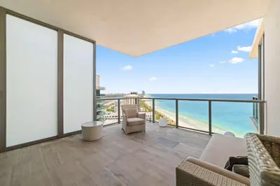a living room with a view of the ocean at Luxury 5 Stars - Oceanfront Stay for 4 with World-Class Amenities in Miami Beach