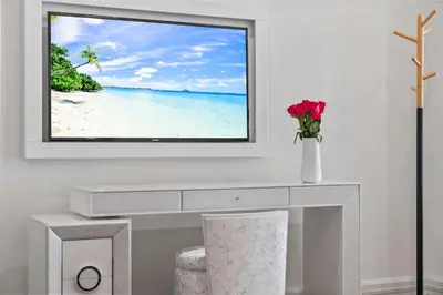 a white desk with a picture of a beach at Luxury 5 Stars - Oceanfront Stay for 4 with World-Class Amenities in Miami Beach