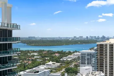a view of a river between two tall buildings at Luxury 5 Stars - Oceanfront Stay for 4 with World-Class Amenities in Miami Beach