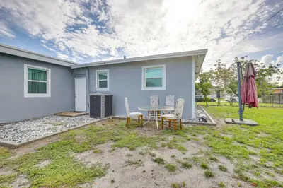 a house with a table and chairs in a yard at Walk to 2026 FIFA World Cup! Home with Spacious Yard in Miami