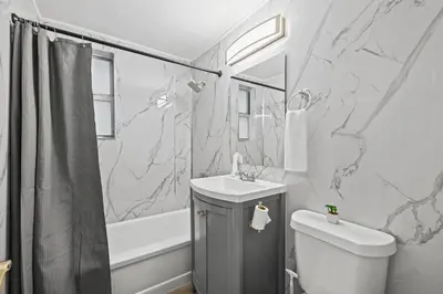 a bathroom with a sink and a toilet and a shower at Harding Apartments by Andes STR in Miami Beach