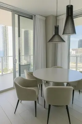 a dining room with a white table and chairs at Miami Escape 16th Floor – Near Hollywood Beach in Hollywood