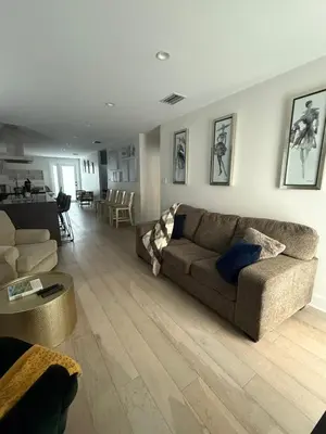 a living room with a couch and a table at Stylish Miami Getaway in Miami