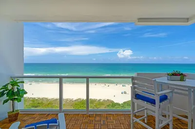 a balcony with a view of the beach at Elara Beachfront 2 Bedrooms Direct OceanView with Parking in Miami Beach
