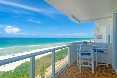 a balcony with a view of the beach at Elara Beachfront 2 Bedrooms Direct OceanView with Parking in Miami Beach