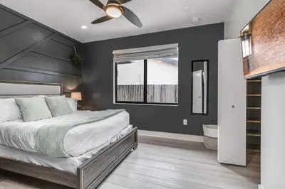 a bedroom with a bed and a ceiling fan at Fox Sonata Downtown Pool House in Fort Lauderdale