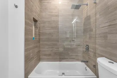 a bathroom with a bath tub and a sink at Fox Sonata Downtown Pool House in Fort Lauderdale