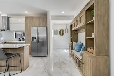 a kitchen with a stainless steel refrigerator at Fox Sonata Downtown Pool House in Fort Lauderdale