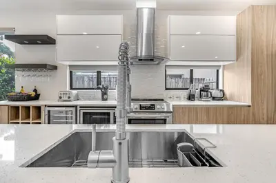 a kitchen with a stainless steel sink in it at Fox Sonata Downtown Pool House in Fort Lauderdale