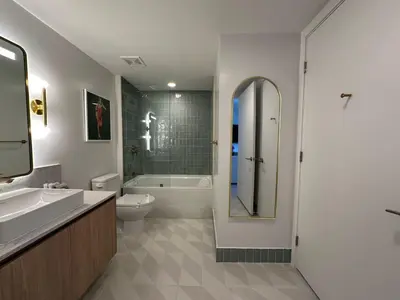 a bathroom with a sink and a toilet and a shower at Downtown Miami view - 38th floor gem in Miami
