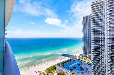 a view of the beach and ocean from a building at Oceanfront Luxe Apt 24th Floor in Hollywood