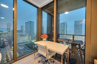 an office with a table and chairs in front of windows at High Floor Unit Heart Of Miami with pool and gym in Miami