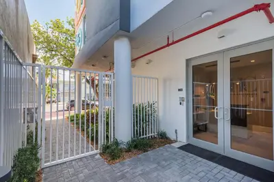 an entrance to a building with a glass door at Modern South Beach 2 Bedroom Gem in Miami Beach