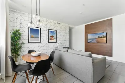 a living room with a couch and a table at Modern South Beach 2 Bedroom Gem in Miami Beach