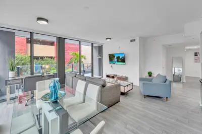 a living room with a couch and a glass table at Amazing 3Beds 3Baths Corner Unit Downtown Miami in Miami