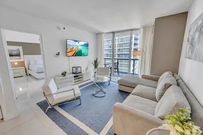 a living room with a couch and a table at 48th Floor ocean View Brickell in Miami