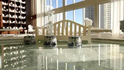 a room with a glass table and chairs in a building at 48th Floor ocean View Brickell in Miami