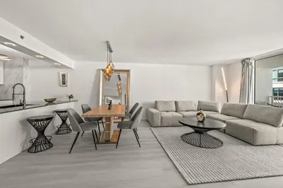 a living room with a couch and a table at High Rise Unit in the heart of Brickell in Miami