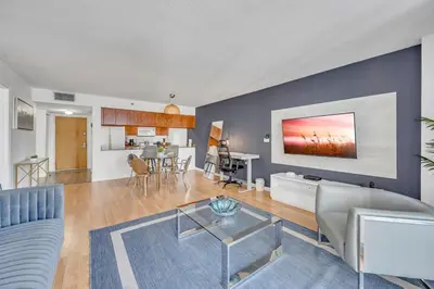 a living room with a couch and a table at Superb private unit with amenities and parking in Miami