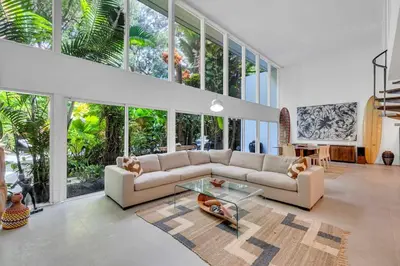 a living room with a couch and a glass table at Wonderful Tropical Pool House Miami Coconut Grove in Miami