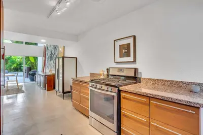 a kitchen with a stove and a counter top at Wonderful Tropical Pool House Miami Coconut Grove in Miami