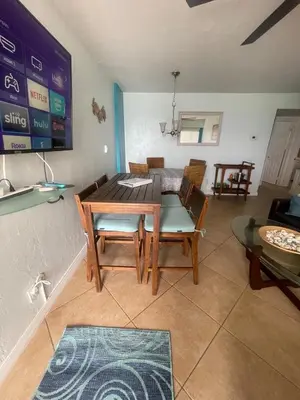 a dining room with a table and chairs at Modern Beachfront Suite at Hollywood Broadwalk in Hollywood