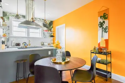 a dining room with a table and chairs in a kitchen at Stylish 2br apt, king-size bed, 5mins to the beach - J3 in Hollywood