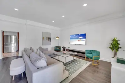 a living room with a couch and a table at Wonderful Tropical Pool House Miami South Brickell in Miami